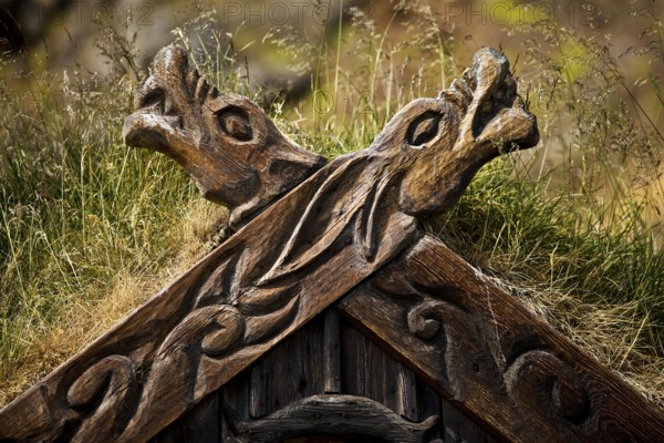 Detail of the wood-carved gable decoration on the Viking house covered with turf at Gudrúnarlaug, Búardalur, West Iceland, Iceland
