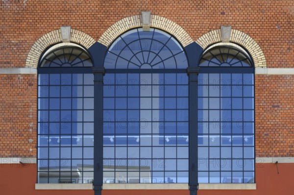 Former factory windows of a brewery boiler house, today artist Stefan Schrumbel's studio, Offenburg, Baden-Württemberg, Germany