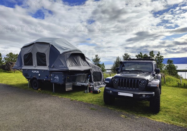 Car with tent trailer at the campsite in Vopnafjördur, East Iceland, Iceland