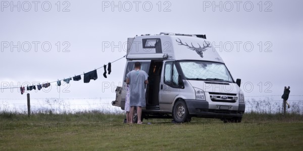 Campervan with clothesline at the campsite in Reykjadiskur at Skagafjördur, Iceland