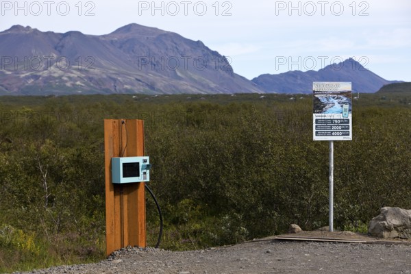 Car park at Brúarfoss waterfall with EC machines for paying in the countryside, South Iceland, Iceland