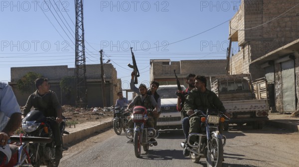 Fighters from the Free Syrian Army celebrate victory after capturing villages that were under the control of ISIS. Aleppo, Syria October 16, 2016, Aleppo, Syria