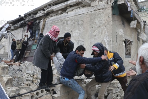 Civil defense teams attempt to rescue civilians trapped under the rubble after a powerful earthquake struck Turkey and Syria, killing tens of thousands. Aleppo, Syria – Feb 6, 2023, aleppo, syria