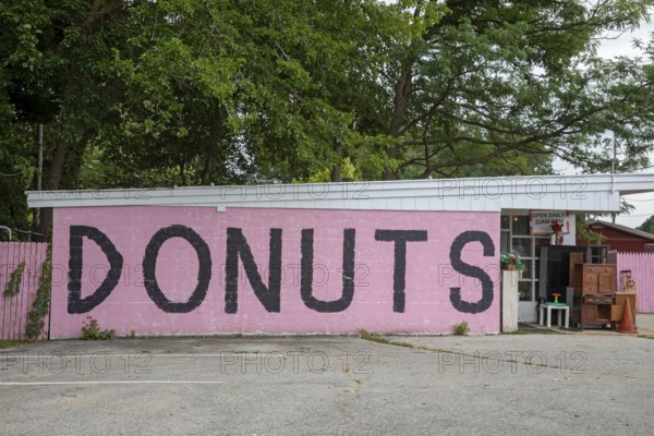 Sawyer, Michigan - A sign on a store along Red Arrow Highway advertises donuts for sale