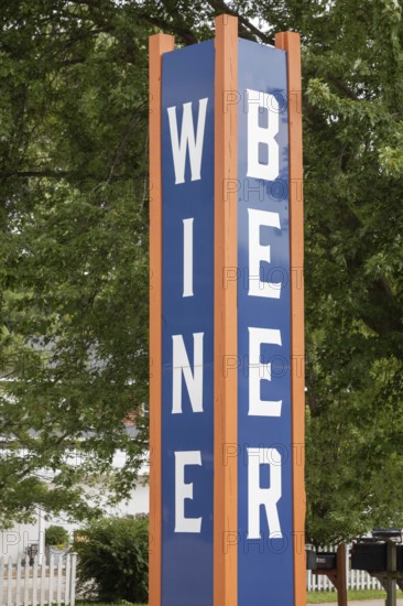 Sawyer, Michigan - A sign at a store along Red Arrow Highway advertises wine and beer for sale