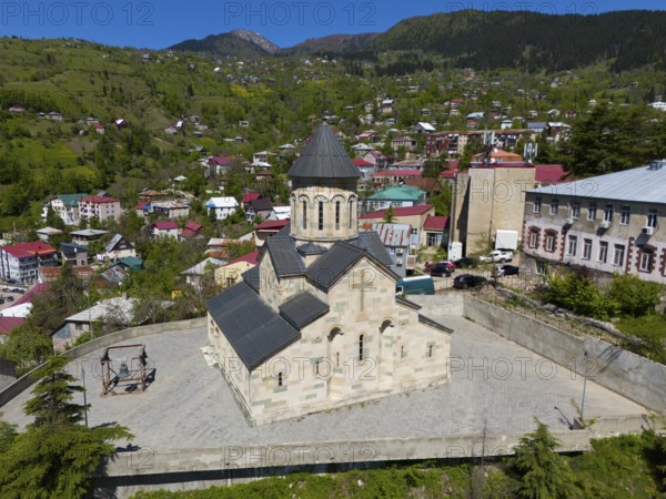 Church in a small mountain village with traditional architecture and green, picturesque surroundings, aerial view, Andrew Apostol Church, Khulo, Chulo, Autonomous Republic of Adjara, Adjara, Lesser Caucasus, Georgia