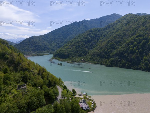 Panoramic view of a green river in a mountainous landscape with a boat, aerial view, confluence of Adjariszqali and Chorokhi, Acharistskali, Adjaris-Tsqali, Acharis-Tsqali, Autonomous Republic of Adjara, Lesser Caucasus, Georgia