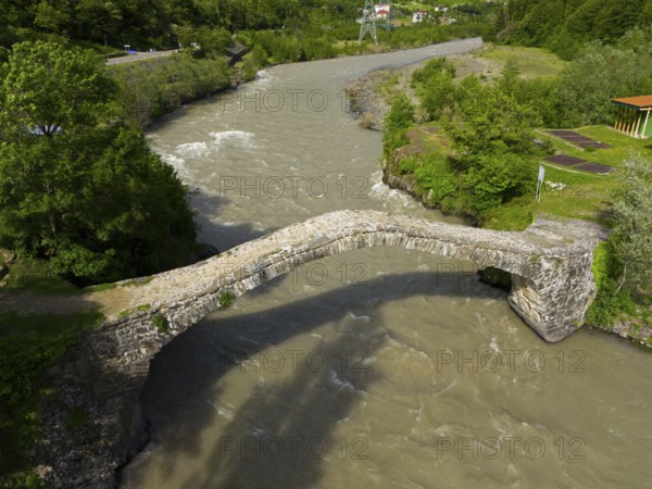 Aerial view of an old stone bridge spanning a river surrounded by green nature, aerial view, stone arch bridge Dandalo, Adjaristskali River, Autonomous Republic of Adjara, Adjara, Adjara, Lesser Caucasus, Georgia