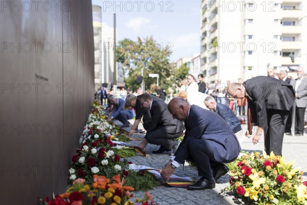 Prof. Dr Axel Klausmeier (Director of the Berlin Wall Foundation and art historian), Kai Wegner (Governing Mayor of Berlin) and other participants lay ribbons at a wreath-laying ceremony to commemorate the division of the city from 13 August 1961 to 9 November 1989 and to remember the victims of tyranny at the Bernauer Strasse memorial, Berlin, 13.08.2025