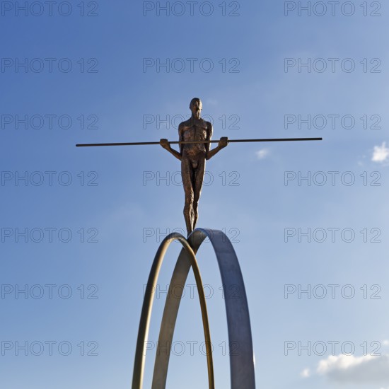 Sculpture Balance by the artist Martina Ondáková in front of a blue sky, human figure balanced, symbolic image, striving for balance and harmony, Oia, Thira, Santorini, Cyclades, Greece