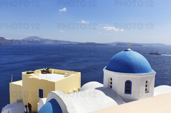 Blue dome of an orthodox church, ferry crossing the sea, Caldera, Oia, Thira, Santorini, Cyclades, Greece
