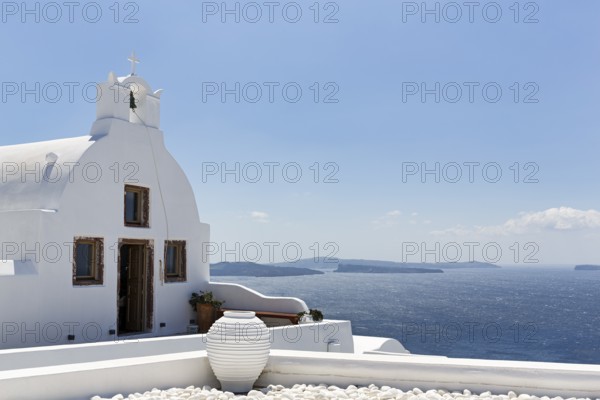 White architecture, orthodox church by the sea, Oia, Santorini, Cyclades, Aegean Sea, Greece