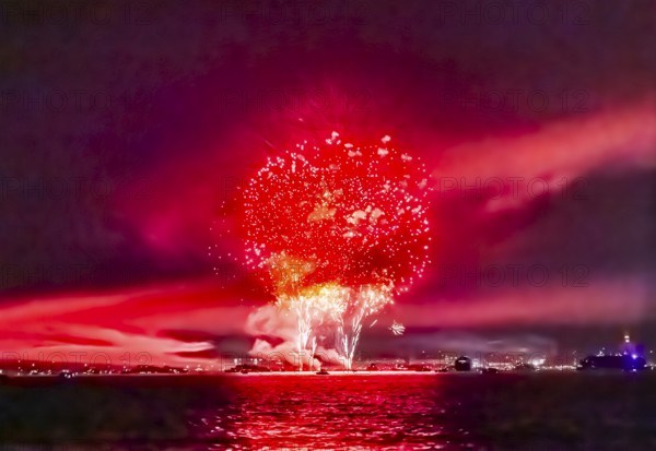 Lake Night Festival Constance. Water fireworks over the German shore and the neighbouring Swiss town of Kreuzlingen. View of the fireworks from Lake Constance. Constance, Baden-Württemberg, Germany