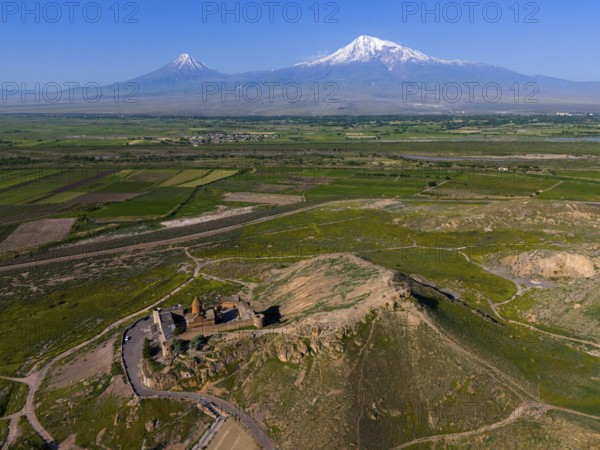 Archaeological site on a hill with sweeping views of the mountains, aerial view, Chor Wirap monastery, Chor Virap, deep dungeon, Ararat and Little Ararat in the background, located in Turkey, Ararat province, Armenia