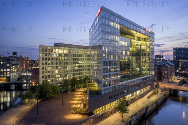 Aerial view of the Spiegel building at Ericusspitze in Hamburg's HafenCity in the Brooktorkai neighbourhood at blue hour, Hamburg, GermanyDefault