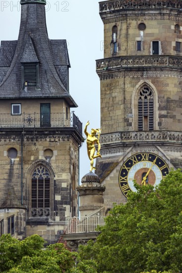 City view of Stuttgart with the two towers of the collegiate church. In between, the Mercury Column with the gilded figure of Mercury. Stuttgart, Baden-Württemberg, Germany