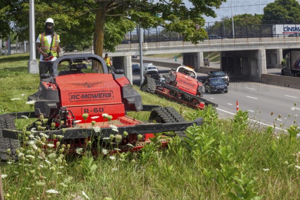 Harper Woods, Michigan - Remote-control mowers are cutting the grass and weeds along Interstate 94 and other freeways running through Detroit. The machines are said to be safer when operating on the steep embankments along most of the city's freeways