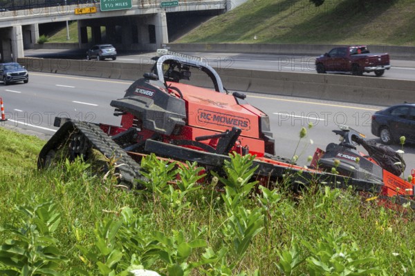 Harper Woods, Michigan, Remote-control mowers are cutting the grass and weeds along Interstate 94 and other freeways running through Detroit. The machines are said to be safer when operating on the steep embankments along most of the city's freeways