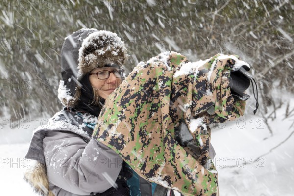 Photographer Veronique Amiard photographs the landscape in winter, Heavy snowfall, Gaspesie national park, Province of Quebec, Canada, North America