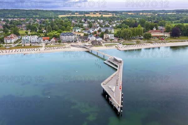 Aerial view over Seebrücke, pier and sandy beach at seaside resort Haffkrug along the Baltic Sea, Scharbeutz, Schleswig-Holstein, Germany