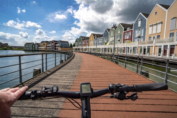 Small town of Houten near Utrecht, bicycles have priority in the town of 50, 000 inhabitants, generous cycle paths, many leisure areas, water areas, living by the water