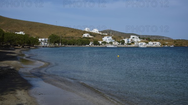 A secluded beach overlooking a coastal settlement and the calm sea, Analipsi, Maltezana, Astypalea, Astipalea, Astipaleia, Dodecanese, Greek Islands, Greece