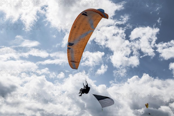 Paragliding tandem flight with Canton Fribourg flag, Interlaken, Switzerland