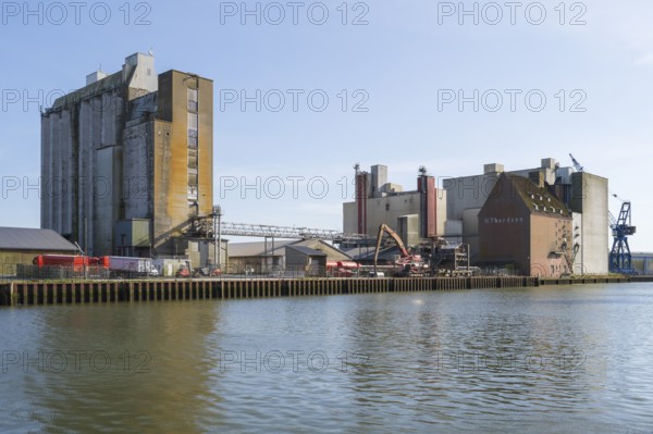 Grain silos, warehouses, land trade, outer harbour, Husum, North Frisia, North Sea, Schleswig-Holstein, Germany