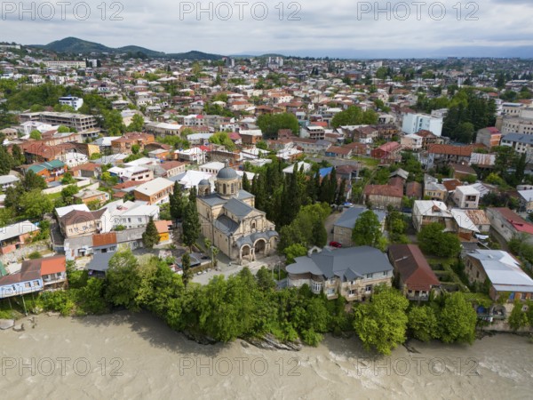 Close-up of a city view with a central church, residential houses and a river next to wooded hills, aerial view, Orthodox Church of the Annunciation, Kutaisi, Kutaisi, Imereti region, Georgia, Asia