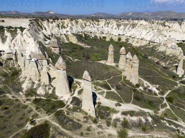 High rock towers rise in an impressive valley scenery in Cappadocia, aerial view, Love Valley, Göreme National Park, Göreme Tarihî Millî Parki, Nevsehir Province, Nevsehir, Cappadocia, Cappadocia, Cappadocia, Cappadocia, Central Anatolia, Turkey