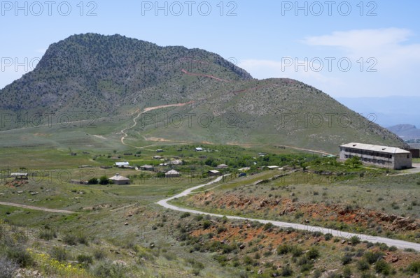 Village in a green hilly landscape under a blue sky, K?rk, Karki or Tigranaschen is a village belonging to Azerbaijan under international law and surrounded by Armenian territory, occupied by Armenia and administered by the province of Ararat, Azerbaijani exclave, M2, Azerbaijan