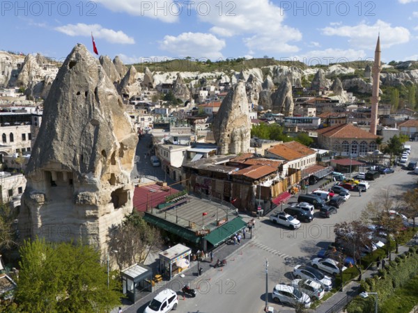 View of a town in Cappadocia with characteristic rocks and traditional architecture under a blue sky, aerial view, Göreme, Göreme National Park, Göreme Tarihî Millî Parki, Nevsehir Province, Nevsehir, Cappadocia, Cappadocia, Kapadokya, Cappadocia, Central Anatolia, Turkey