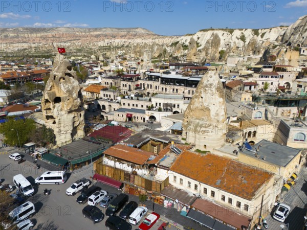 Historical buildings in combination with impressive rock formations with an urban backdrop, aerial view, Göreme, Göreme National Park, Göreme Tarihî Millî Parki, Nevsehir Province, Nevsehir, Cappadocia, Cappadocia, Cappadocia, Cappadocia, Central Anatolia, Turkey