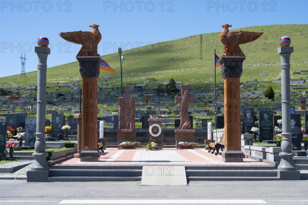 Impressive monument with eagle statues in a peaceful cemetery setting, memorial to the heroes of Artsakh in Nagorno-Karabakh, Gyumri, Alexandropol, Leninakan, Shirak Province, Armenia