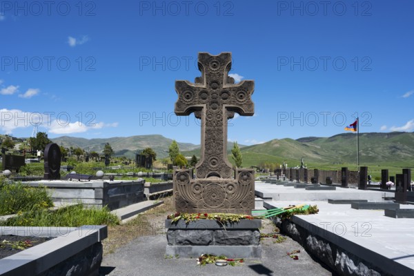 Detailed stone cross monument in a peaceful landscape at a cemetery, Gyumri, Alexandropol, Leninakan, Shirak Province, Armenia