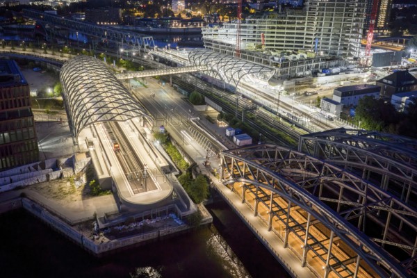Blue hour aerial view of the Hamburg Elbbrücken U4 underground and suburban railway station and the Elbtower construction site, Hamburg, Germany