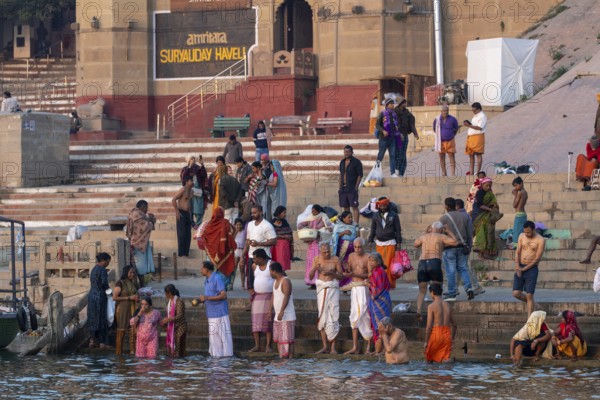 Hindu devotees take a dip in the Ganges, at Hanuman Ghat, Mughalsarai, Uttar Pradesh, India