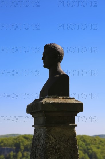 Hauff monument, bust of Wilhelm Hauff, monument modelled on the model of the Stuttgart sculptor Theodor Wagner, cast in ore. at Lichtenstein Castle, fairytale castle of Württemberg, romantic fairytale castle on the eaves of the Swabian Alb, Honau, municipality of Lichtenstein, Baden-Württemberg, Germany