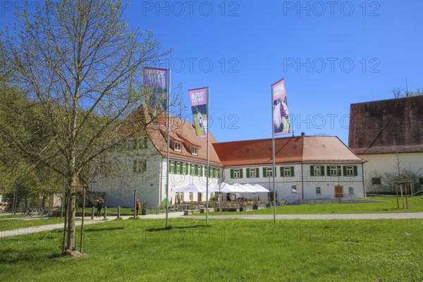 Gestütsgasthof near the stud farm and the Lauterquelle, terrace, sunshades, catering, restaurant, building, green shutters, flags, flagpole, Offenhausen, municipality of Gomadingen, Swabian Alb, Baden-Württemberg, Germany
