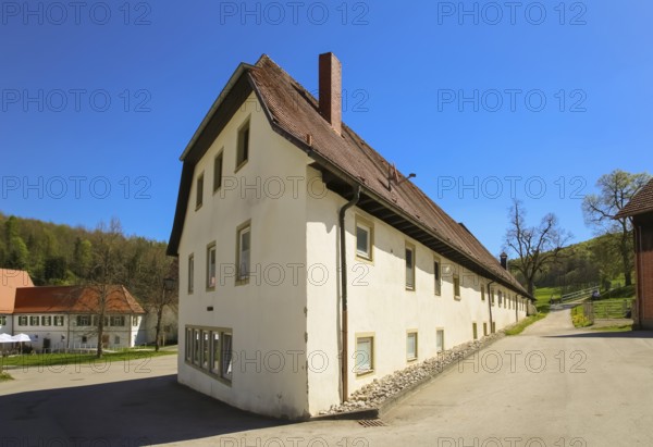 Outbuilding, house, stud farm, at the back left stud farm inn at the Lauterquelle, Offenhausen, municipality of Gomadingen, Swabian Alb, Baden-Württemberg, Germany