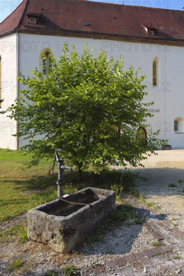 Fountain, stone basin with hand pump, water dispenser, behind the stud museum at the Lauterquelle, municipality of Gomadingen, Swabian Alb, Baden-Württemberg, Germany
