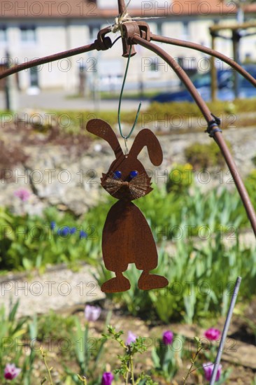 Herb garden near the stud farm museum and the Lauter spring, hare replica, metal, rust, steel, animal figure, ornament, Offenhausen, municipality of Gomadingen, Swabian Alb, Baden-Württemberg, Germany