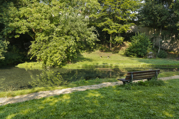 Lauter spring, Große Lauter, karst spring pot, park, idyll, meadow, lawn, trees, wooden bench, Offenhausen, municipality of Gomadingen, Swabian Alb, Baden-Württemberg, Germany