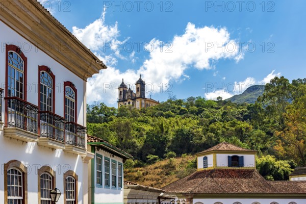 Facades of colonial houses and a baroque church in the historic city of Ouro Preto, Ouro Preto, Minas Gerais, Brazil