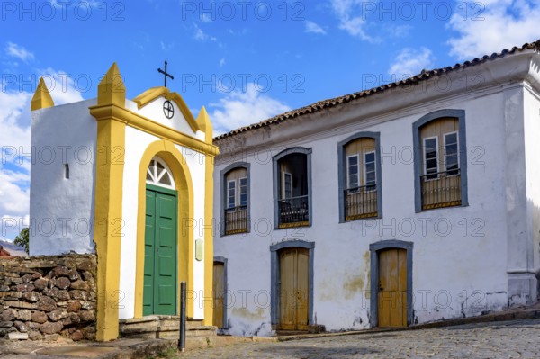 Small chapel and historic mansion on the streets of the city of Ouro Preto in, Ouro Preto, Minas Gerais, Brazil