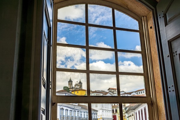 City of Ouro Preto seen through the window of an old colonial-style house, Ouro Preto, Minas Gerais, Brazil