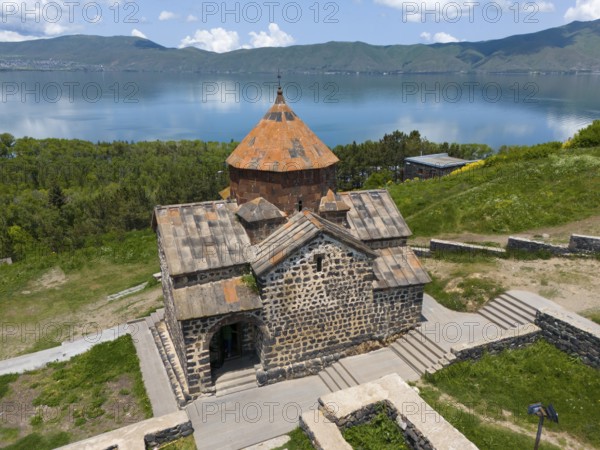 Tranquil view of a historic monastery with mountain and lake views under a clear sky, aerial view, Sevanavank Monastery, Sevan Monastery, Gegharkunik Province, Armenia