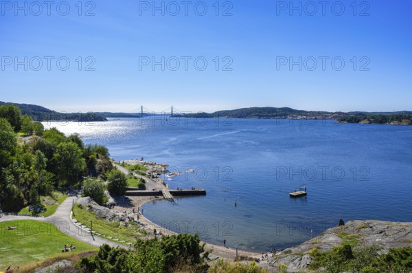 View over the beach promenade to the Byfjord with the Uddevallabron (Uddevalla Bridge) in the background, Uddevalla, Bohuslän, Västra Götalands län, Sweden