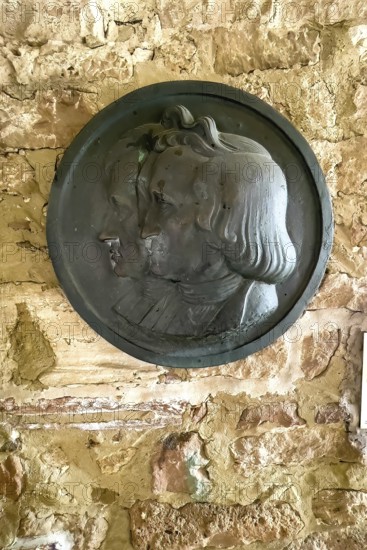 Commemorative plaque with relief Bronze half relief with heads in profile of Brothers Grimm Brothers Jakob Wilhelm Grimm, Steinau an der Straße, Hesse, Germany
