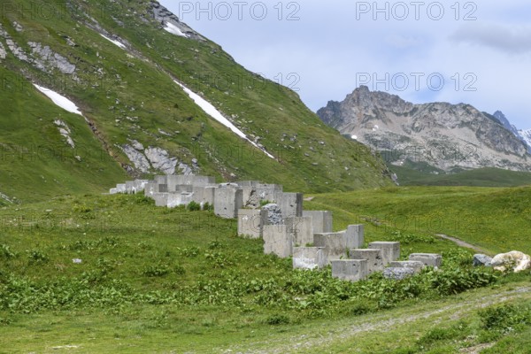 Historical border fortification military border fortification from World War II in the form of concrete blocks Blocks made of concrete on the border 2188 metre high border pass in the Alps between France and Italy Little Saint Bernard Pass, Col du Petit Saint-Bernard, Colle del Piccolo San Bernardo, Département Savoie, France, Region Valle d'Aosta, Italy